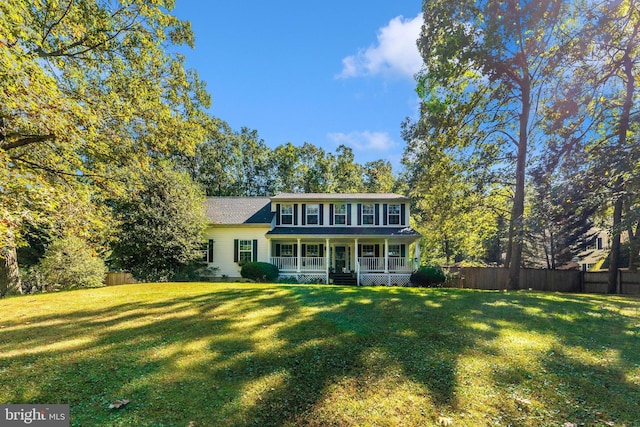 view of front of home with a front yard and a porch