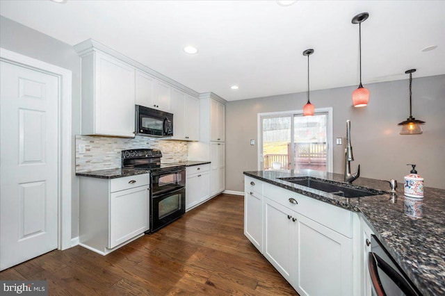 kitchen featuring white cabinetry, black appliances, and dark stone counters