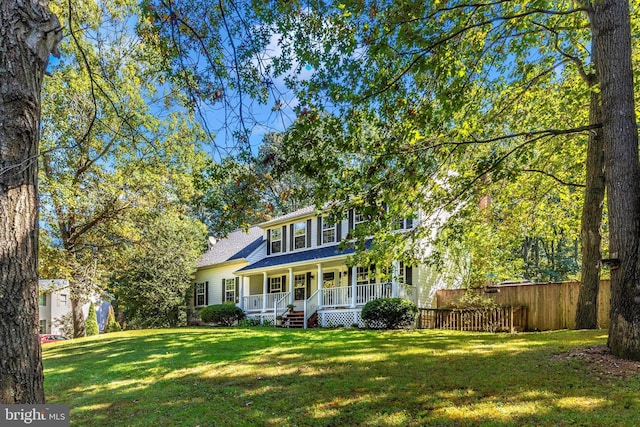 view of front of house featuring a front yard and covered porch