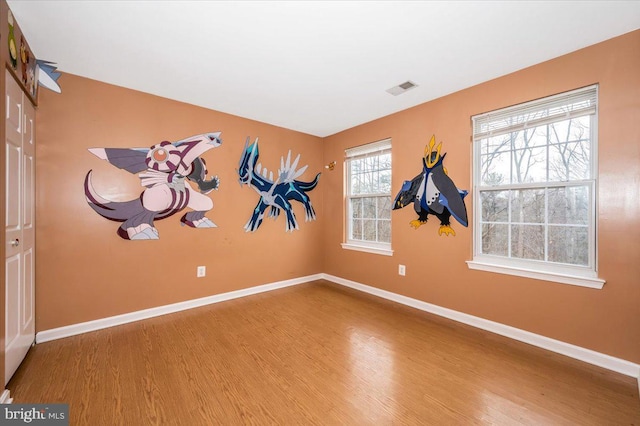 empty room featuring hardwood / wood-style flooring