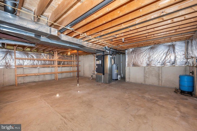 basement with electric water heater and heating unit