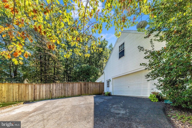 view of property exterior with a garage