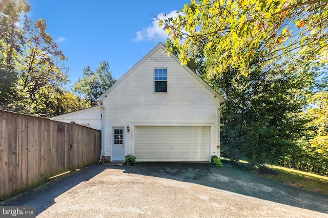 view of side of property with a garage