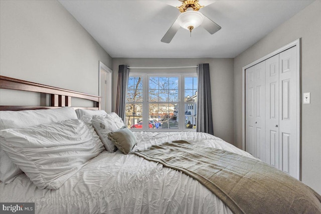 bedroom featuring ceiling fan and a closet