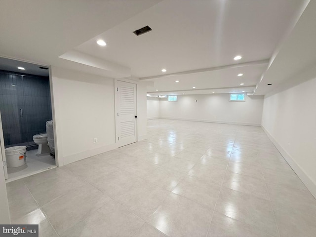 basement featuring light tile patterned floors