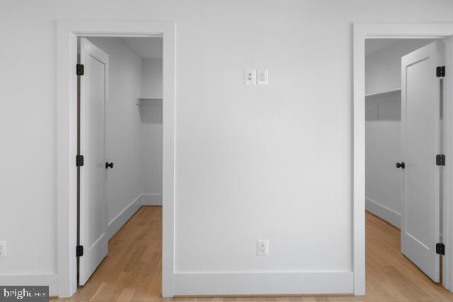 corridor featuring light hardwood / wood-style floors