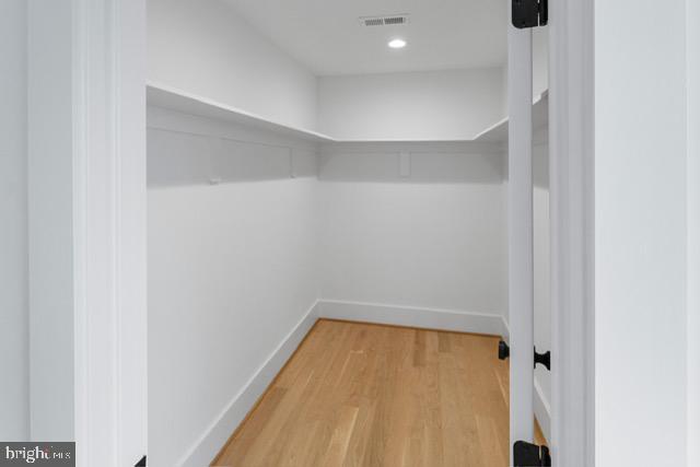 spacious closet featuring wood-type flooring