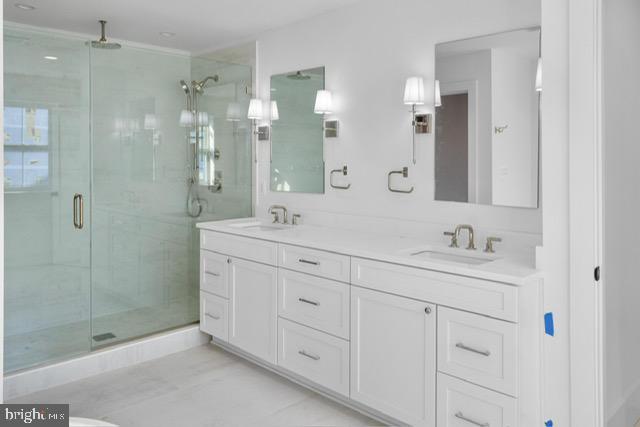 bathroom with vanity and walk in shower