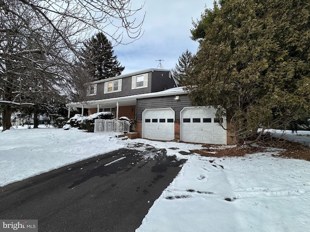 view of front facade with a porch and a garage