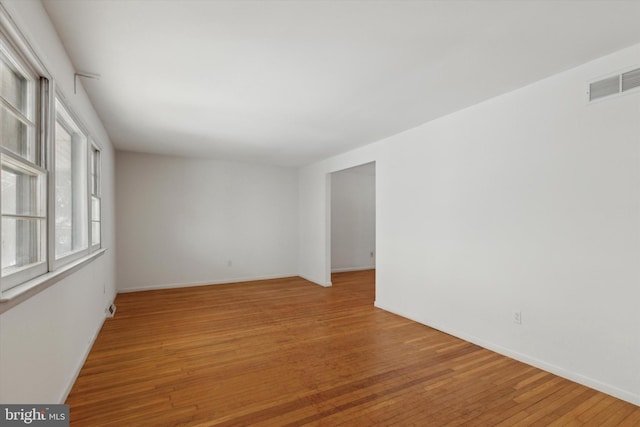 spare room featuring hardwood / wood-style floors