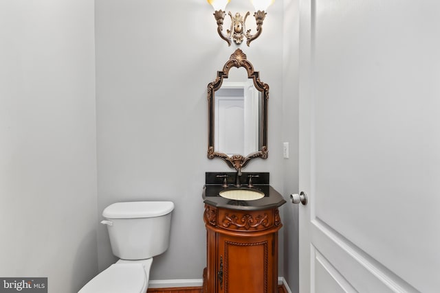 bathroom featuring vanity and toilet