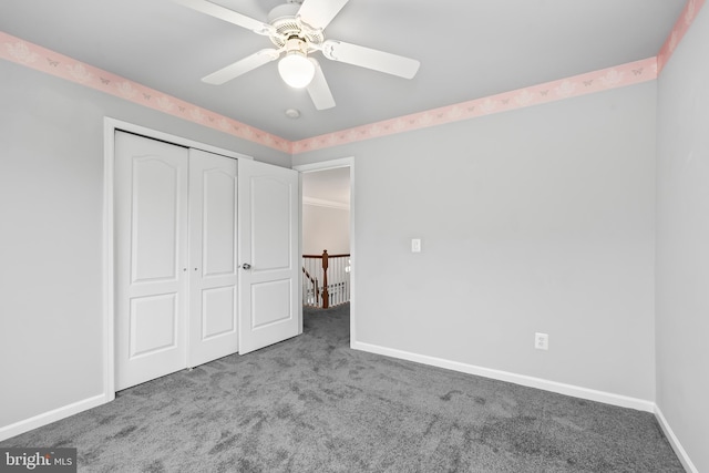 unfurnished bedroom featuring light carpet, ceiling fan, and a closet