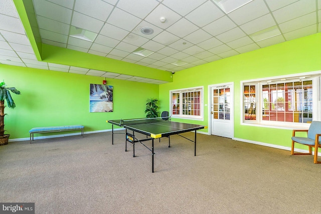 game room featuring carpet floors and a drop ceiling