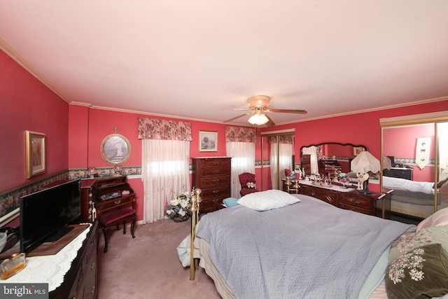 bedroom with a ceiling fan, light carpet, and crown molding