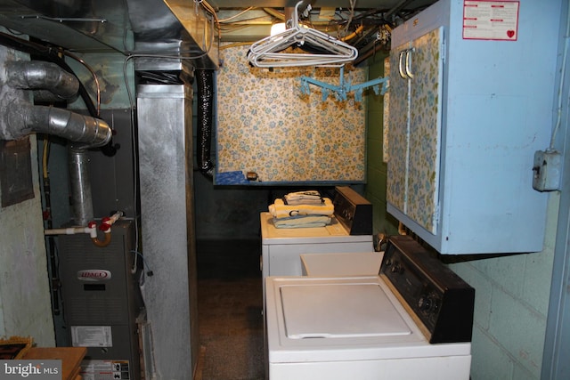 laundry room featuring washing machine and dryer, laundry area, and electric panel