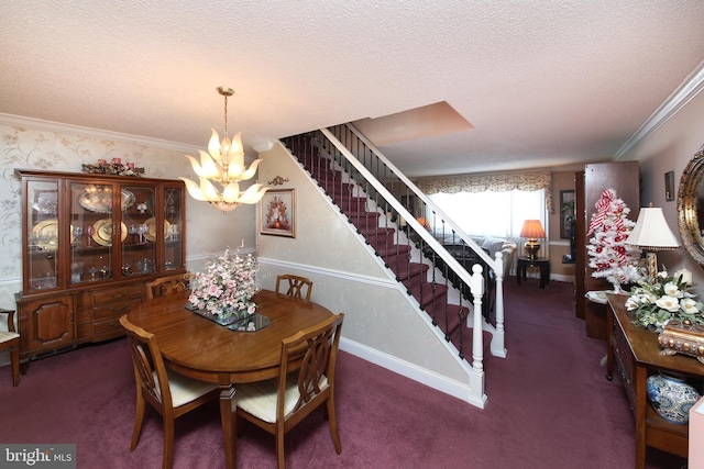 carpeted dining area featuring a textured ceiling, an inviting chandelier, and ornamental molding