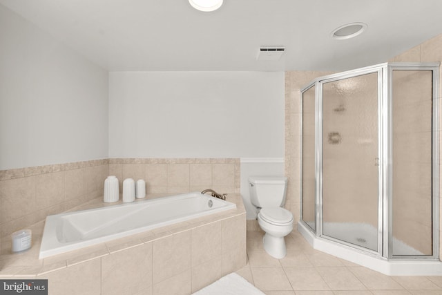 bathroom featuring tile patterned floors, independent shower and bath, and toilet