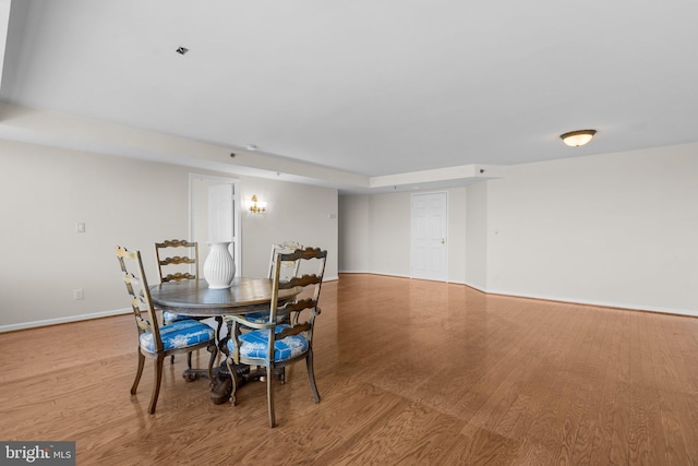 dining area with light hardwood / wood-style flooring