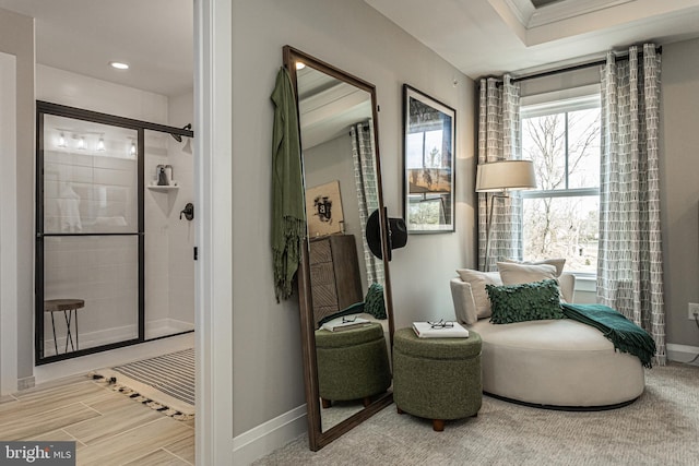 living area with crown molding