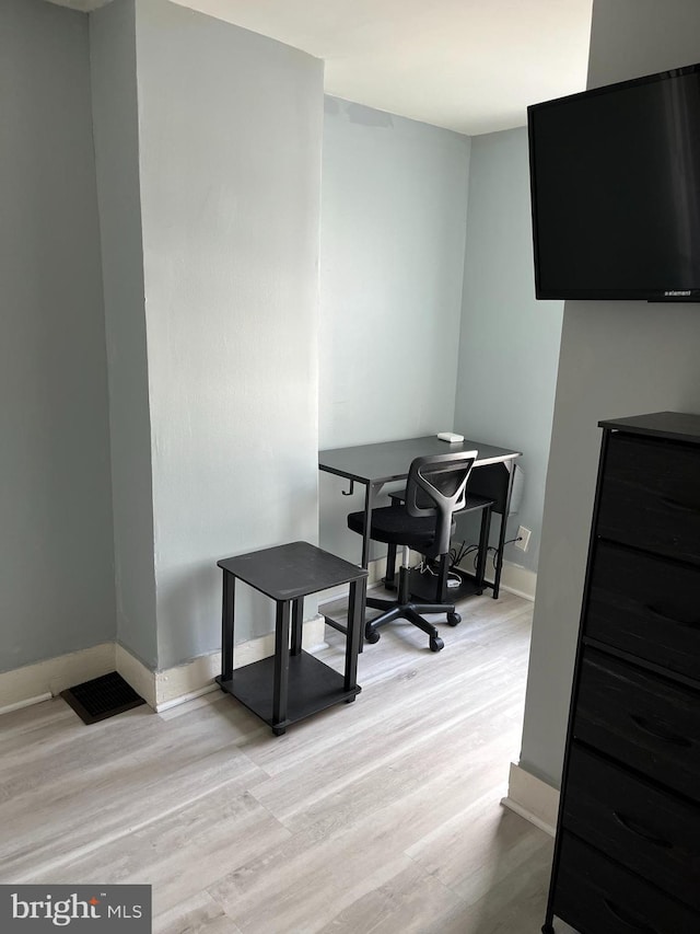 office area with light hardwood / wood-style floors