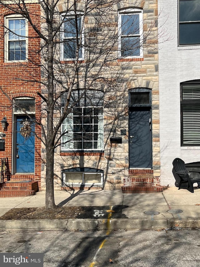 property entrance with a patio area