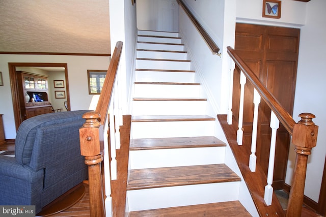 stairs featuring ornamental molding