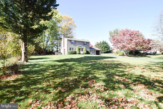 view of yard featuring a garage