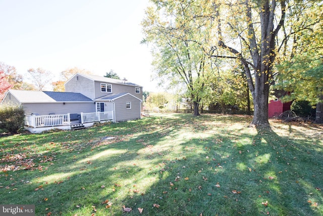 view of yard with a deck