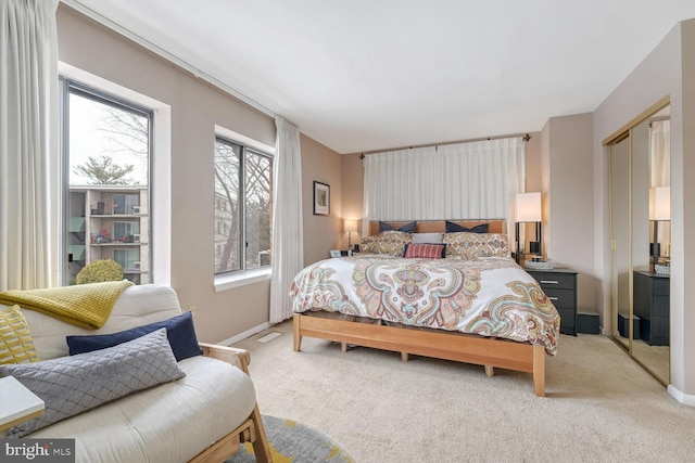 bedroom featuring light carpet