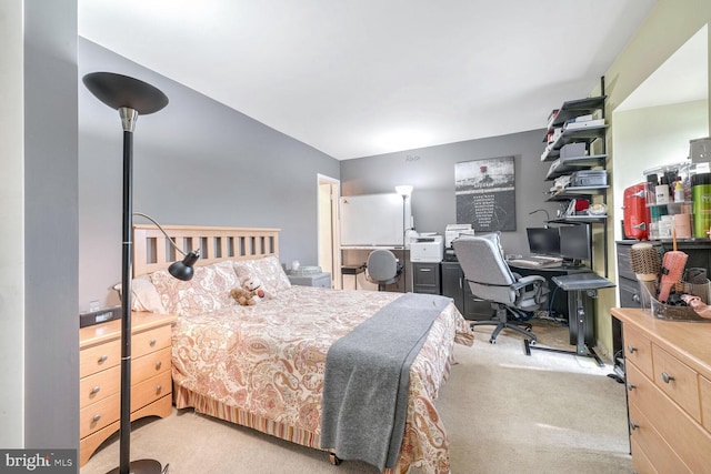 bedroom featuring light carpet