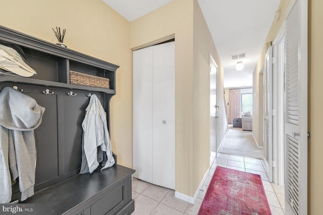 mudroom featuring light tile patterned flooring