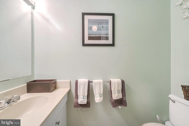 bathroom with toilet and vanity