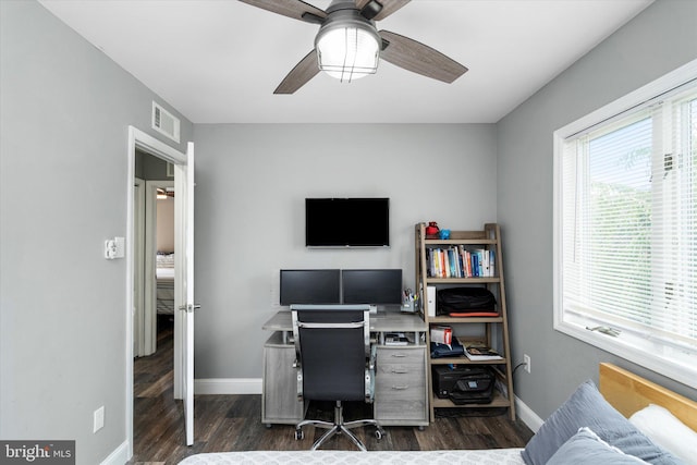 office space featuring ceiling fan and dark wood-type flooring