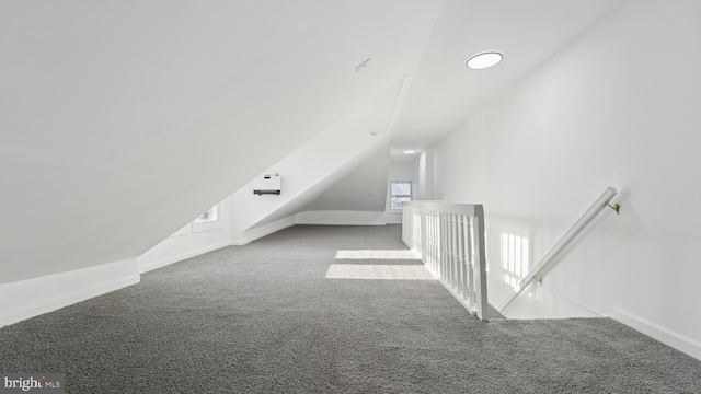 additional living space with carpet, plenty of natural light, and lofted ceiling