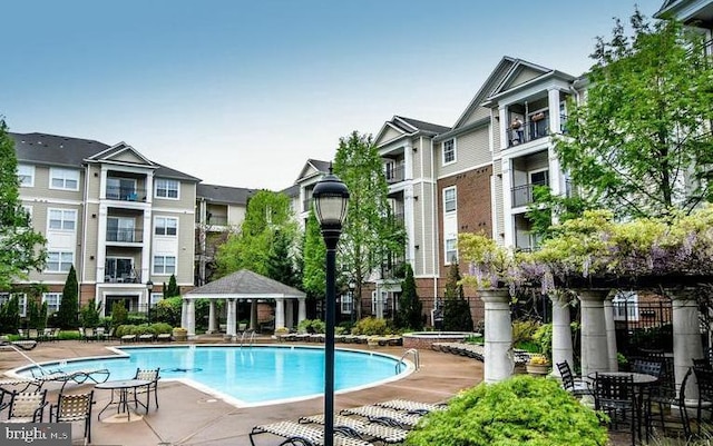 view of swimming pool featuring a gazebo and a patio