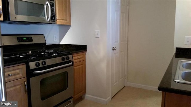 kitchen with appliances with stainless steel finishes and sink