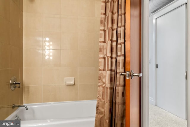 bathroom with shower / bathtub combination with curtain