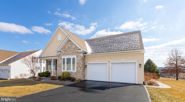 view of front of house featuring a garage and a front yard