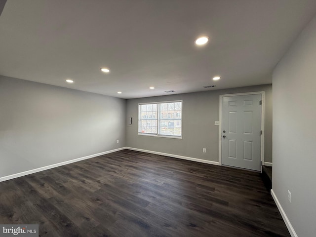 interior space with dark hardwood / wood-style flooring