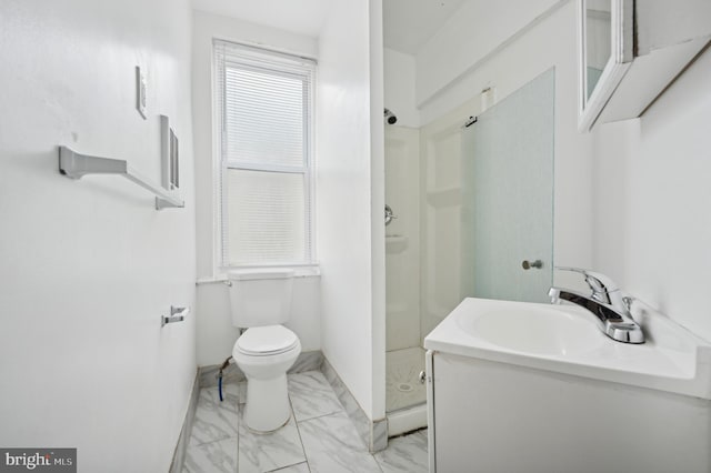 bathroom featuring toilet, walk in shower, and vanity