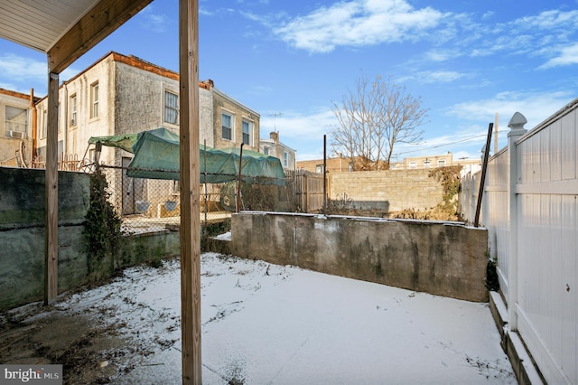 view of yard covered in snow