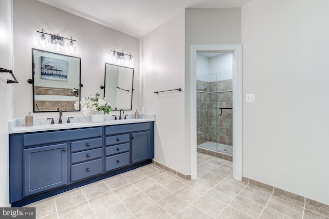 bathroom with vanity, tile patterned floors, and a shower with shower door