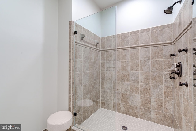 bathroom featuring a shower with door