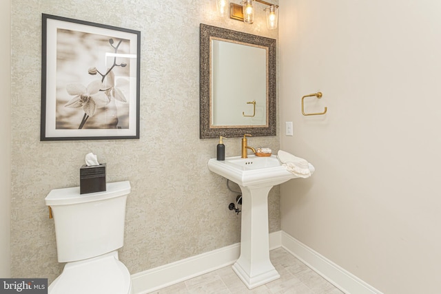 bathroom featuring toilet and tile patterned floors