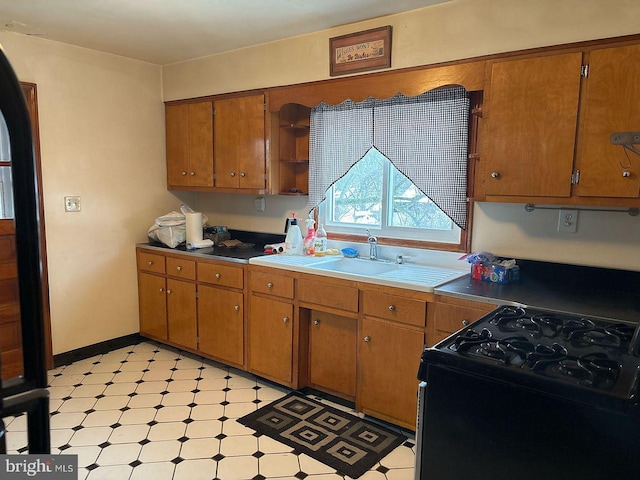 kitchen featuring sink and gas stove