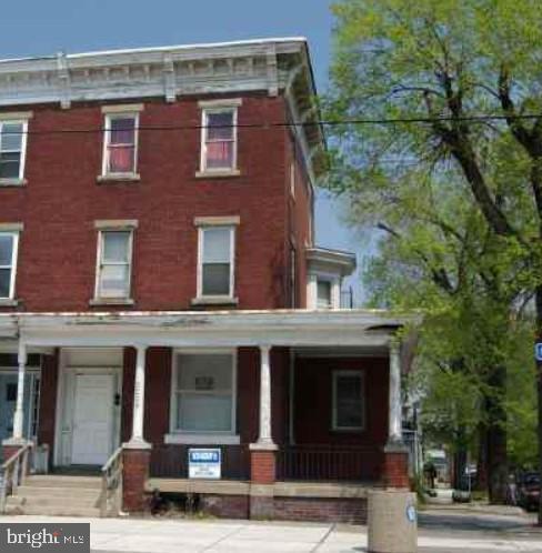 italianate home with covered porch