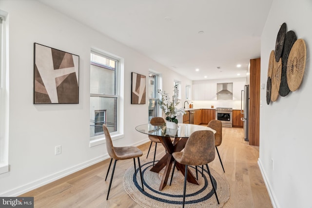 dining space featuring light hardwood / wood-style flooring