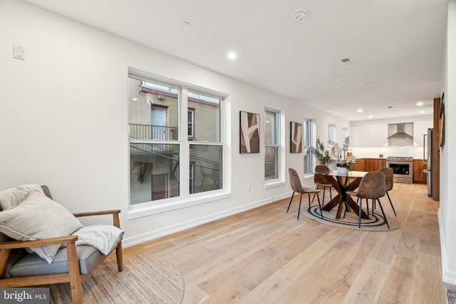 dining room with light hardwood / wood-style floors