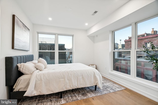 bedroom with hardwood / wood-style floors