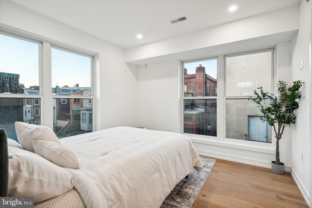 bedroom with wood-type flooring